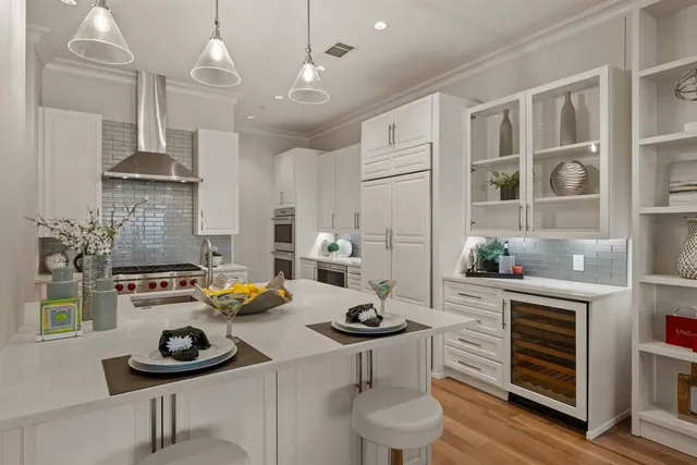 a kitchen with a sink stove and cabinets