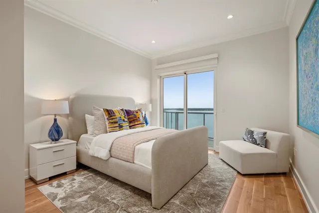 a bedroom with a bed and a couch