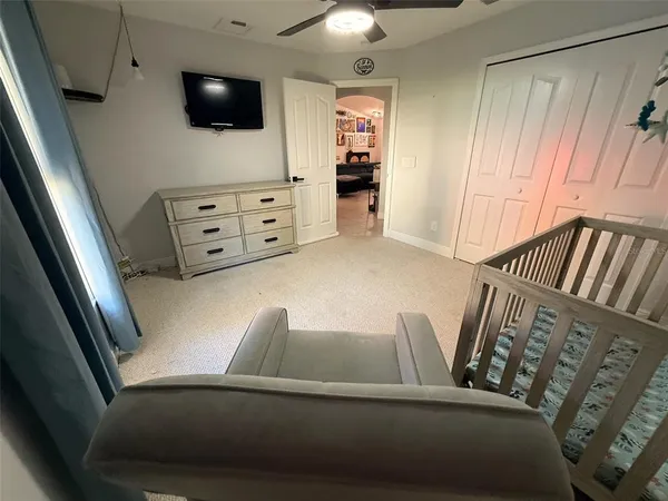 a view of living room with furniture and flat screen tv