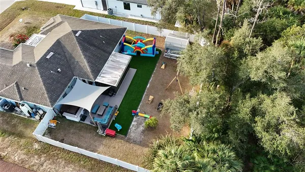 an aerial view of a house with outdoor space