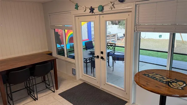 a view of a hallway with furniture and window