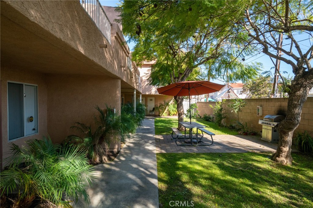 11932 207th Street Lakewood, CA 90715 - Photo 13 of 15 an outdoor view of patio with umbrella