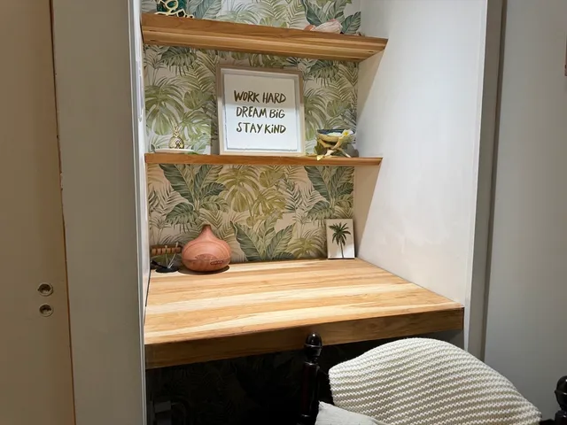 a bedroom with a bed and cabinets