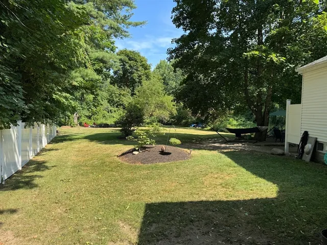 a view of a swimming pool with a yard