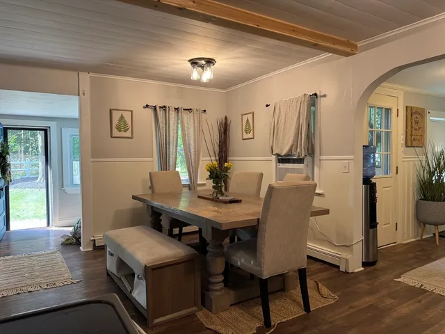 a view of a livingroom with furniture and window