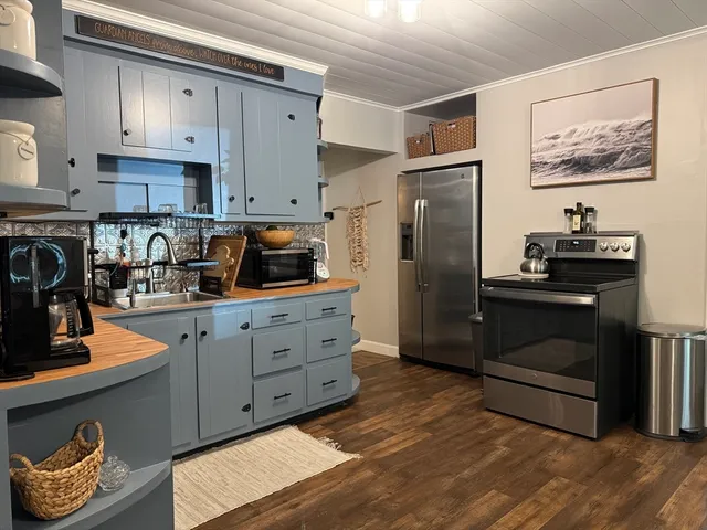 a kitchen with stainless steel appliances cabinets and a counter top space
