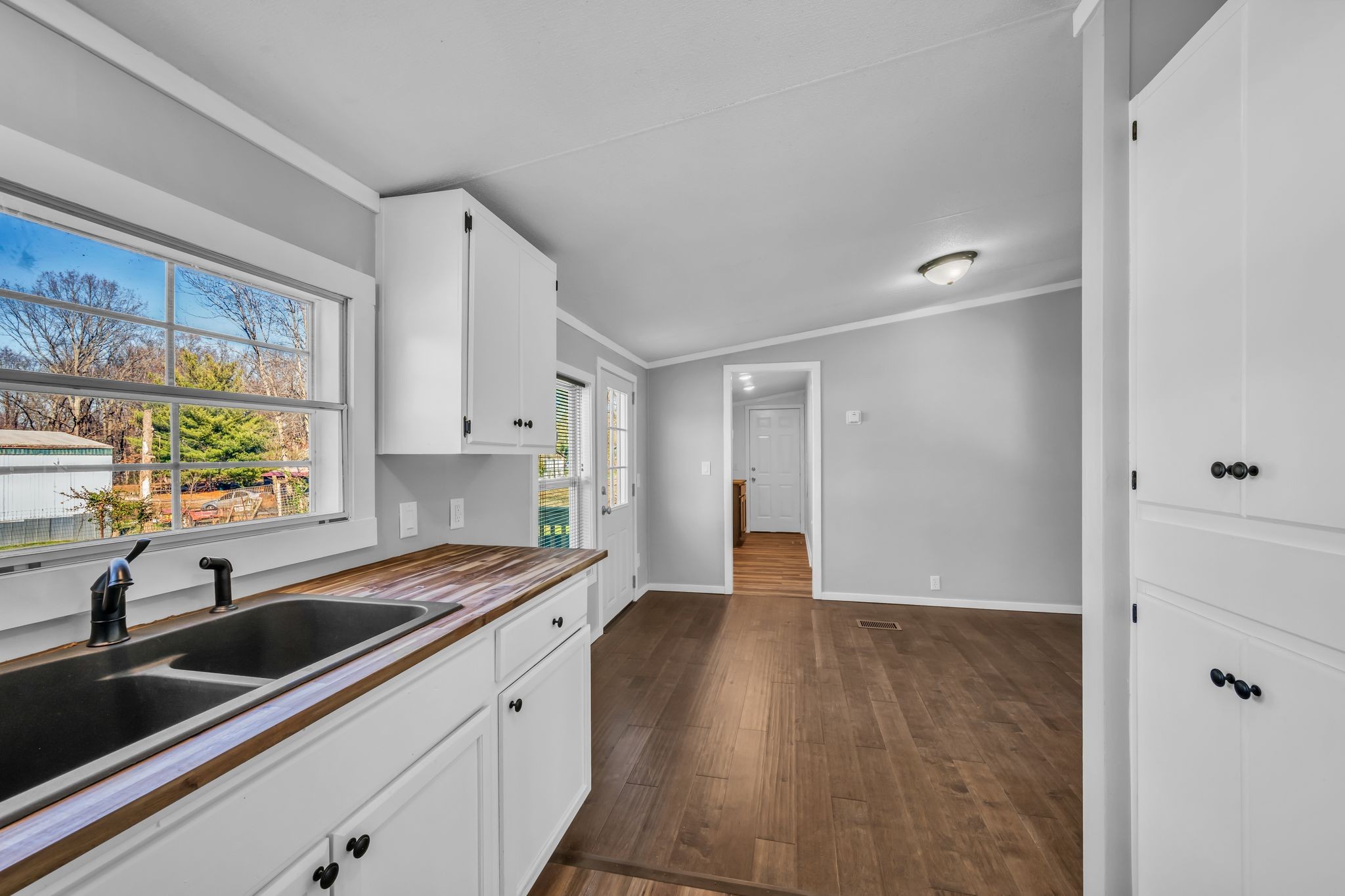 2335 Wayne Road Bon Aqua, TN 37025 - Photo 14 of 30 a kitchen with a sink window and cabinets