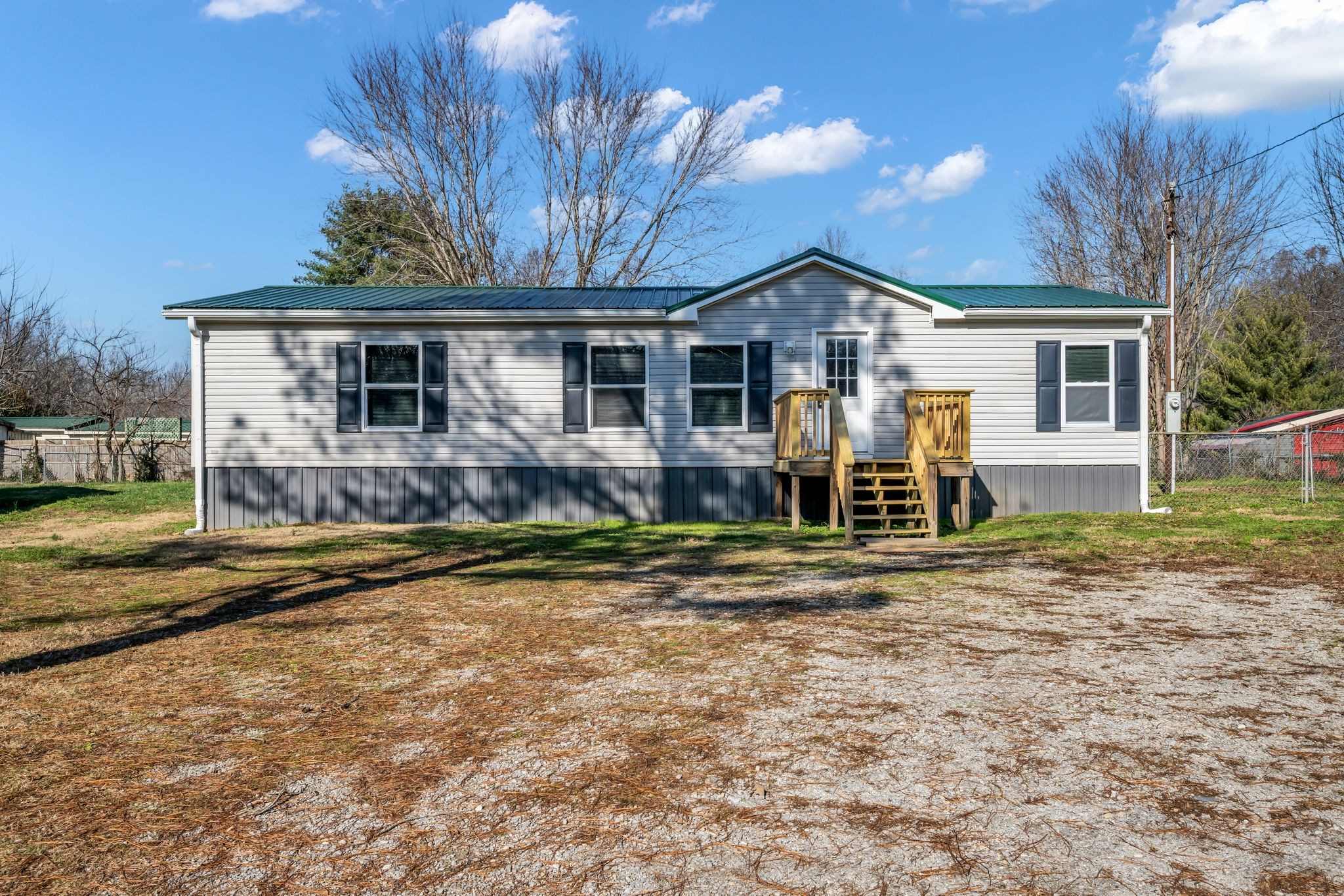 2335 Wayne Road Bon Aqua, TN 37025 - Photo 2 of 30 a front view of a house with porch yard and furniture