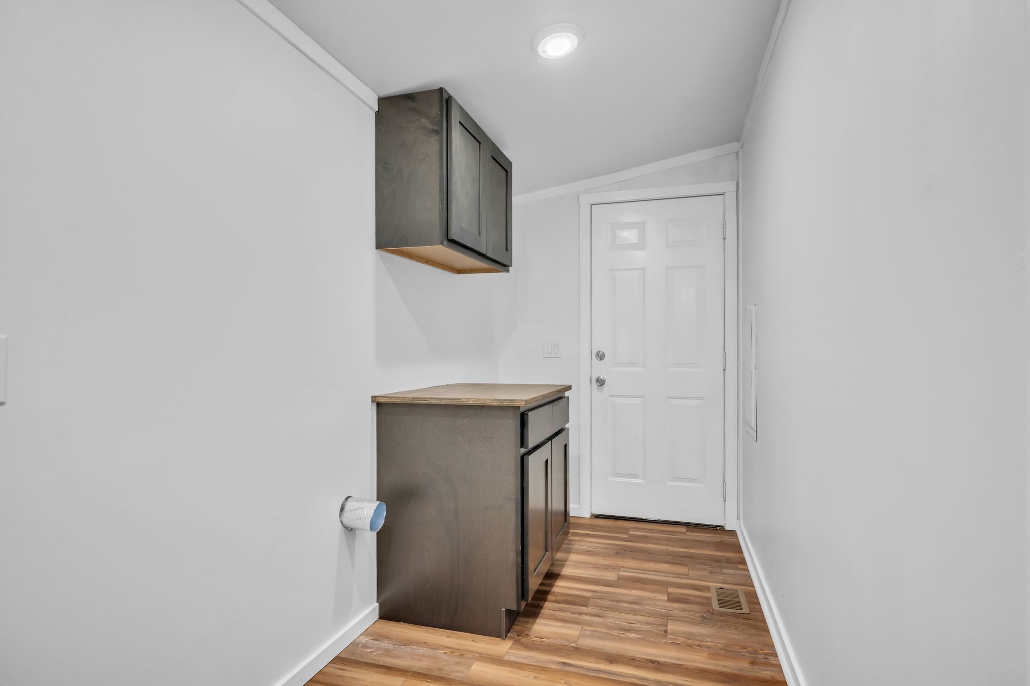 2335 Wayne Road Bon Aqua, TN 37025 - Photo 26 of 30 a view of a hallway with wooden floor and entryway
