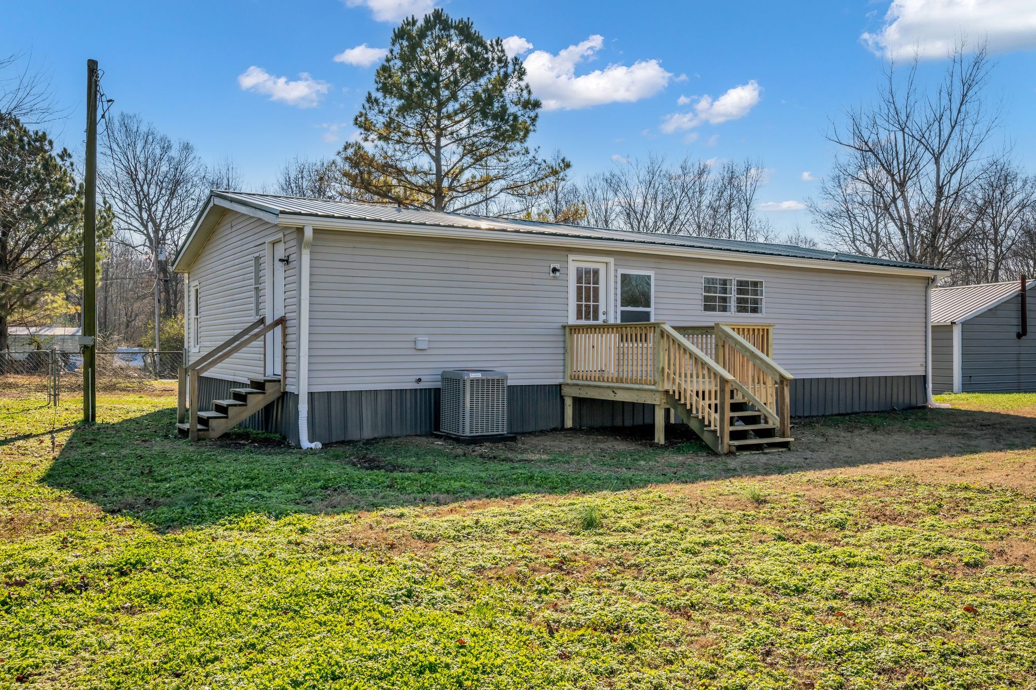 2335 Wayne Road Bon Aqua, TN 37025 - Photo 27 of 30 a view of a house with a yard
