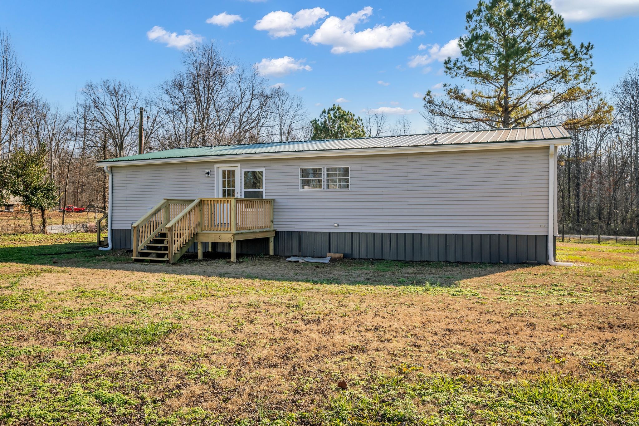 2335 Wayne Road Bon Aqua, TN 37025 - Photo 28 of 30 a view of a house with a yard