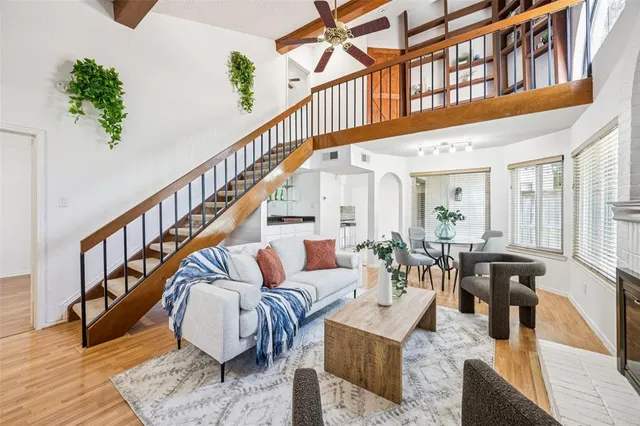a living room with furniture or wooden floor and a potted plant
