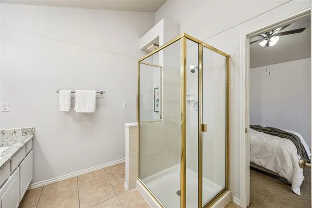a bathroom with a shower and a tub
