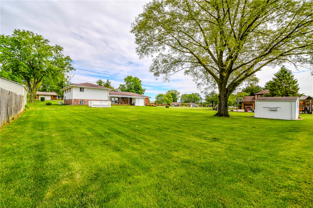 10833 Kendig Road Medway, OH 45341 - Photo 44 of 46 This expansive yard offers ample space for outdoor enjoyment and includes a useful storage shed.