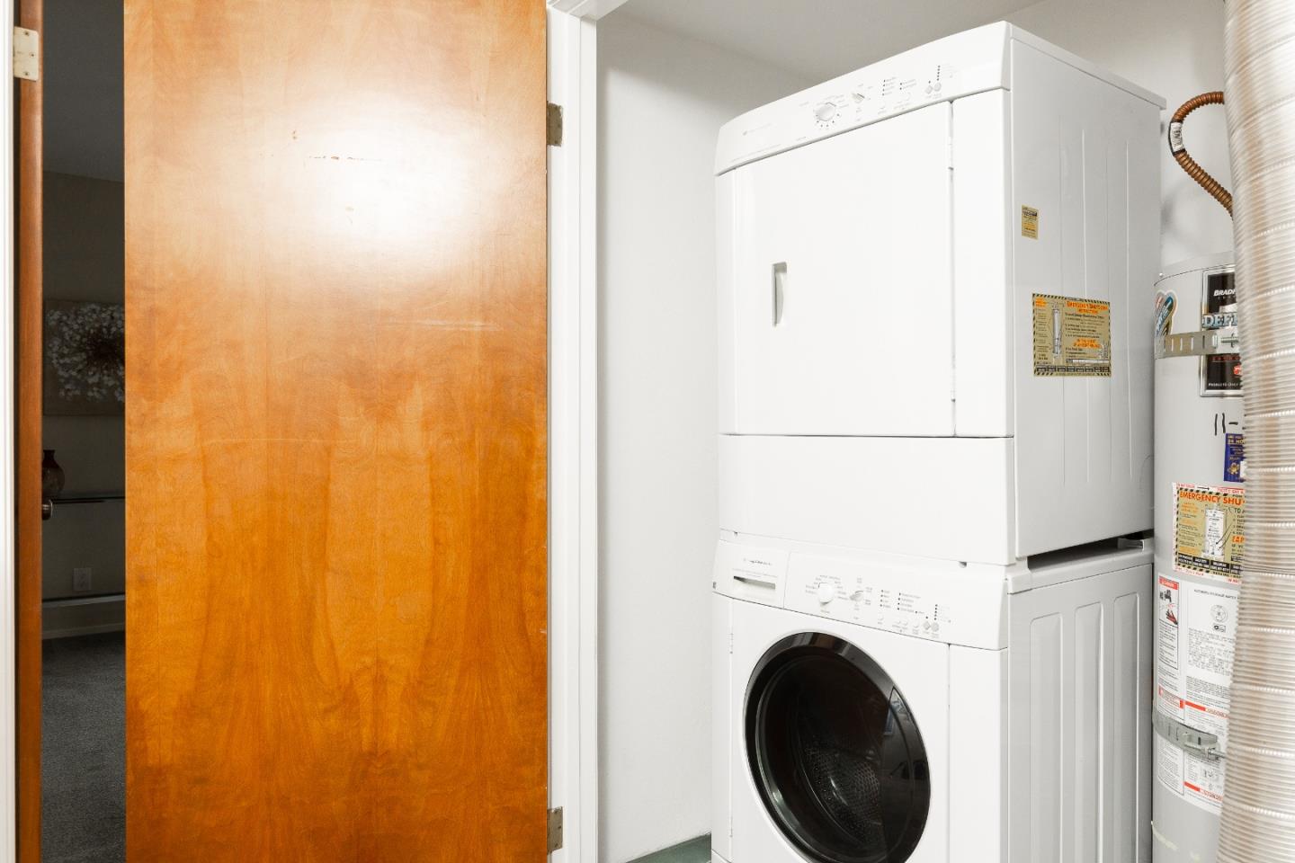 803 Curtis Street Menlo Park, CA 94025 - Photo 11 of 17 a view of a hallway with washer and dryer