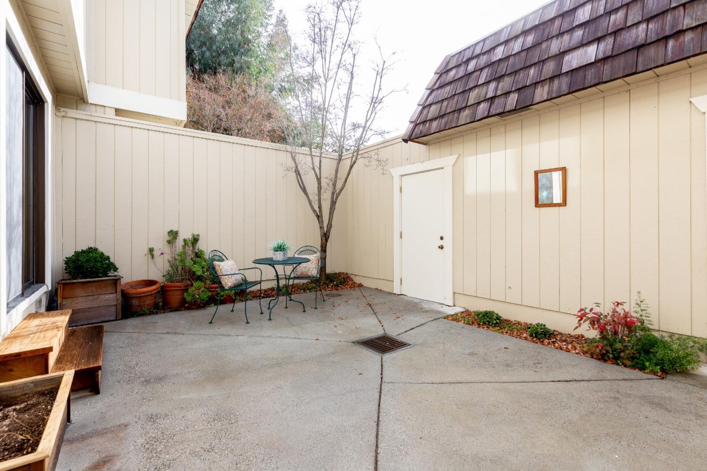 803 Curtis Street Menlo Park, CA 94025 - Photo 12 of 17 a backyard of a house with chairs