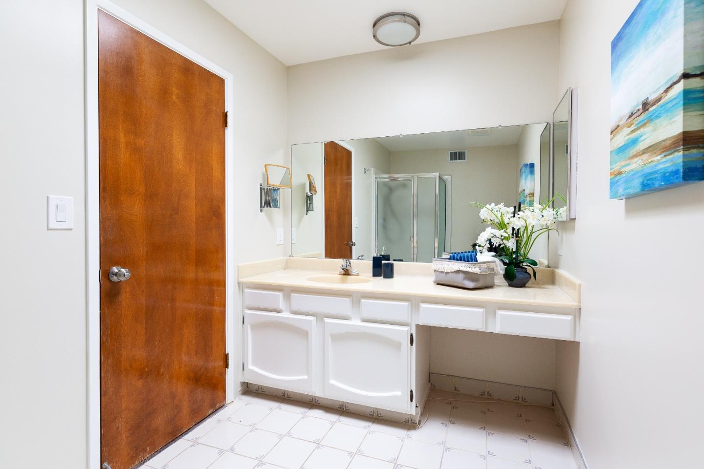 803 Curtis Street Menlo Park, CA 94025 - Photo 8 of 17 a room with a sink and a mirror