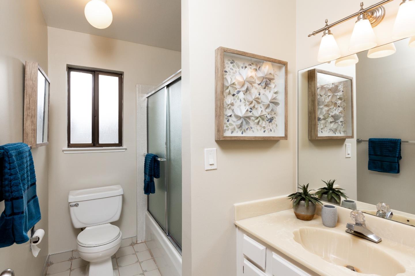 803 Curtis Street Menlo Park, CA 94025 - Photo 10 of 17 a bathroom with a toilet sink and mirror