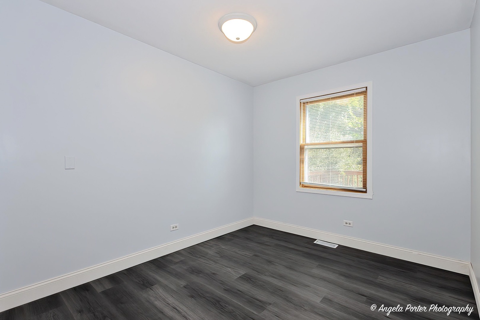 417 Deerpath Drive Lindenhurst, IL 60046 - Photo 13 of 23 an empty room with wooden floor and windows