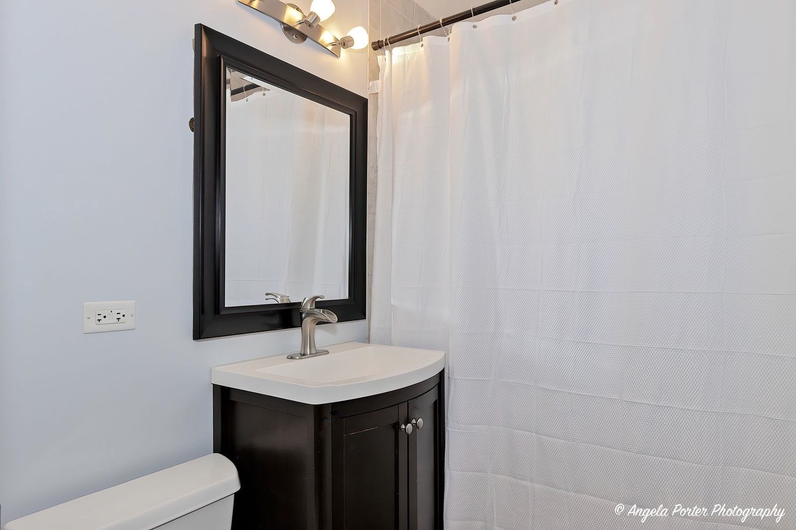 417 Deerpath Drive Lindenhurst, IL 60046 - Photo 14 of 23 a bathroom with a sink and a mirror