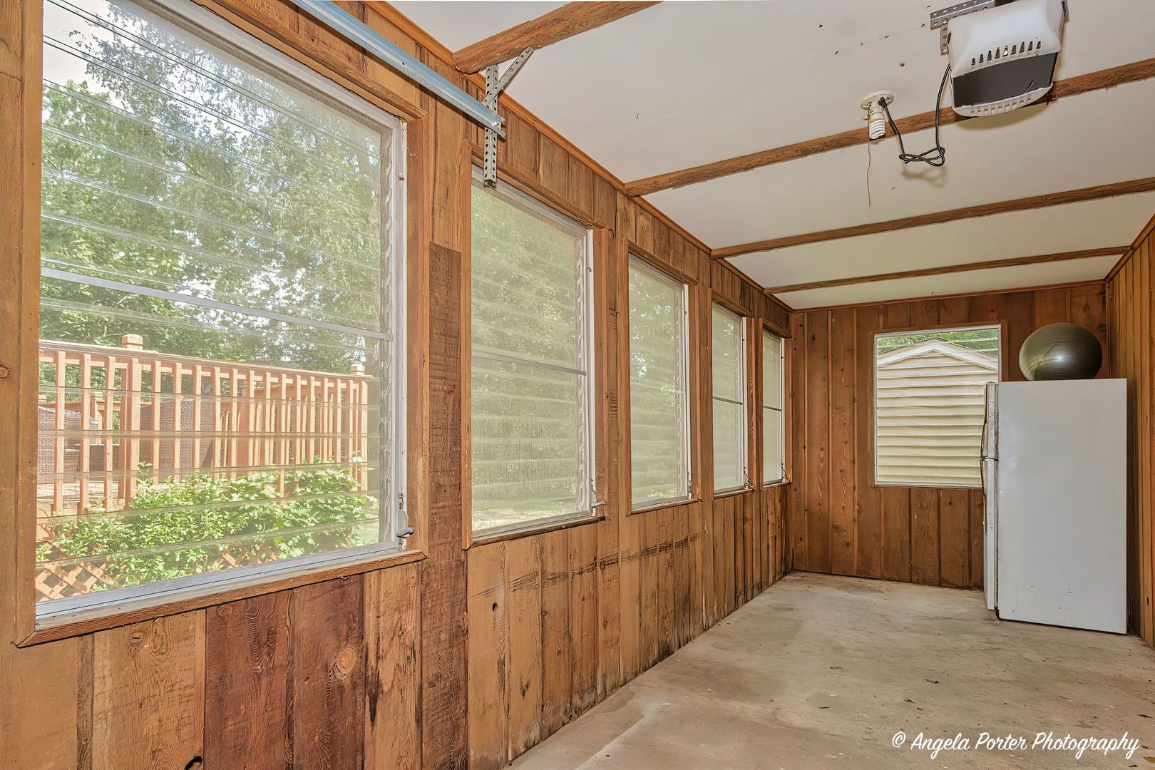 417 Deerpath Drive Lindenhurst, IL 60046 - Photo 22 of 23 a view of a porch with wooden floor and windows
