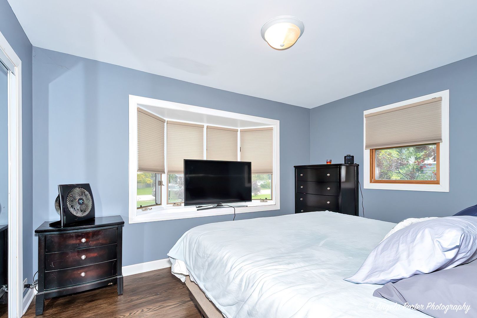 417 Deerpath Drive Lindenhurst, IL 60046 - Photo 10 of 23 a bedroom with a bed and a flat screen tv