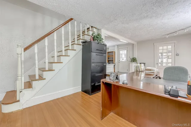a view of kitchen and dining room with wooden floor