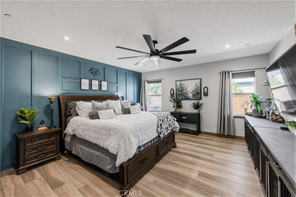 34512 Burnt Pine Road Murrieta, CA 92563 - Photo 5 of 21 a bedroom with a bed and a chandelier