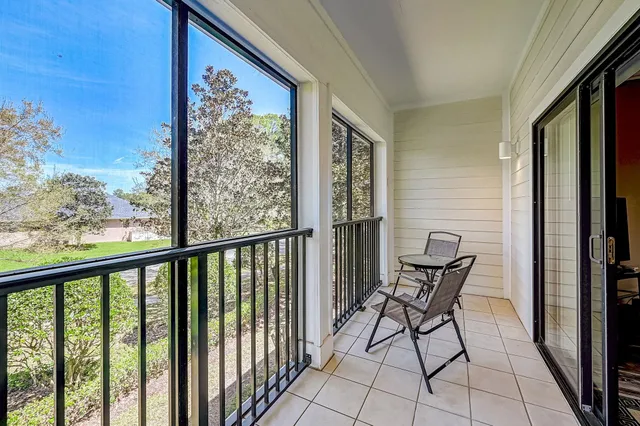 a view of a room with furniture and a window