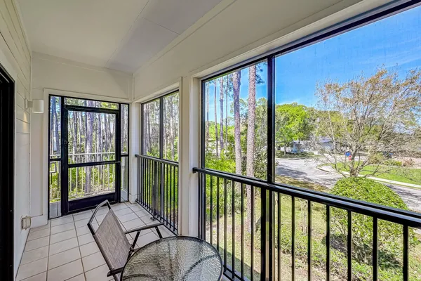 a view of a porch with a floor to ceiling window