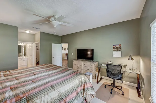 a bedroom with a workspace