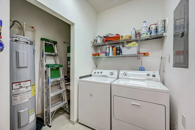 a view of storage and utility room with washer and dryer