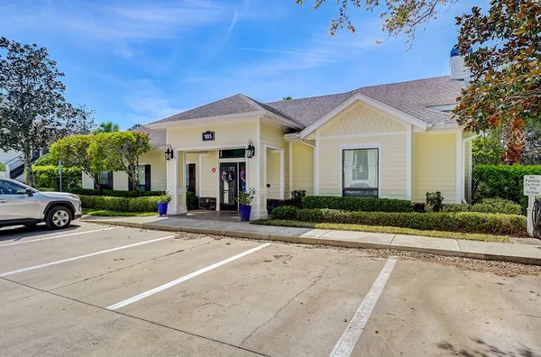 a view of a house with swimming pool and sitting area