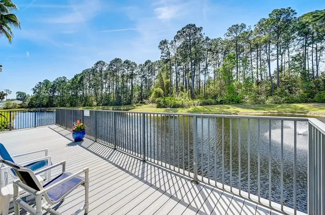 an aerial view of house with a yard and swimming pool