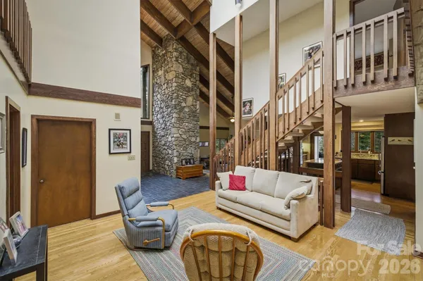 a view of living room filled with furniture and wooden floor