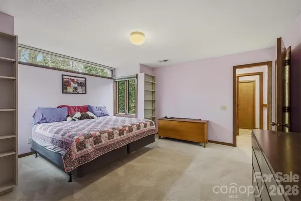 a bed room with a bed and a couch