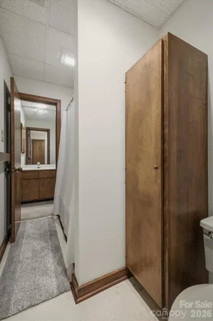 a view of a bathroom from a hallway