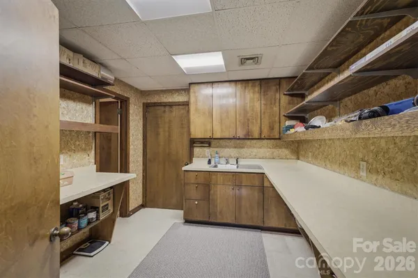 a large bathroom with a double vanity sink and a bathtub