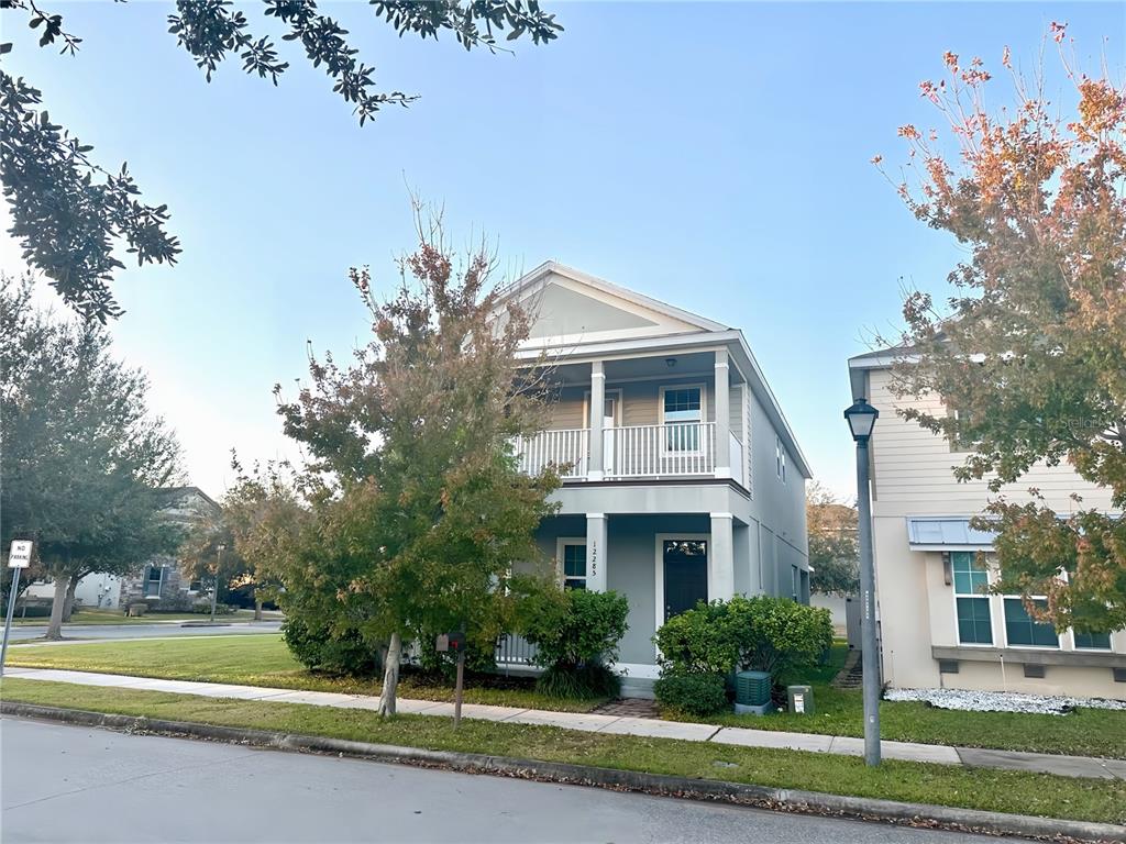 12285 Joshua Tree Trail Windermere, FL 34786 - Photo 1 of 1 a front view of a house with a yard