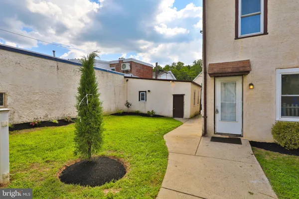 a house view with garden space