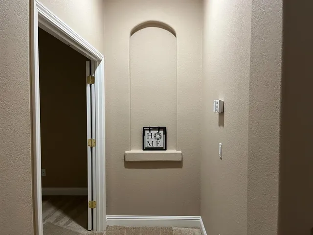 a view of a bathroom with sink and a mirror