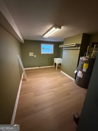 a room with furniture and a air conditioner vent