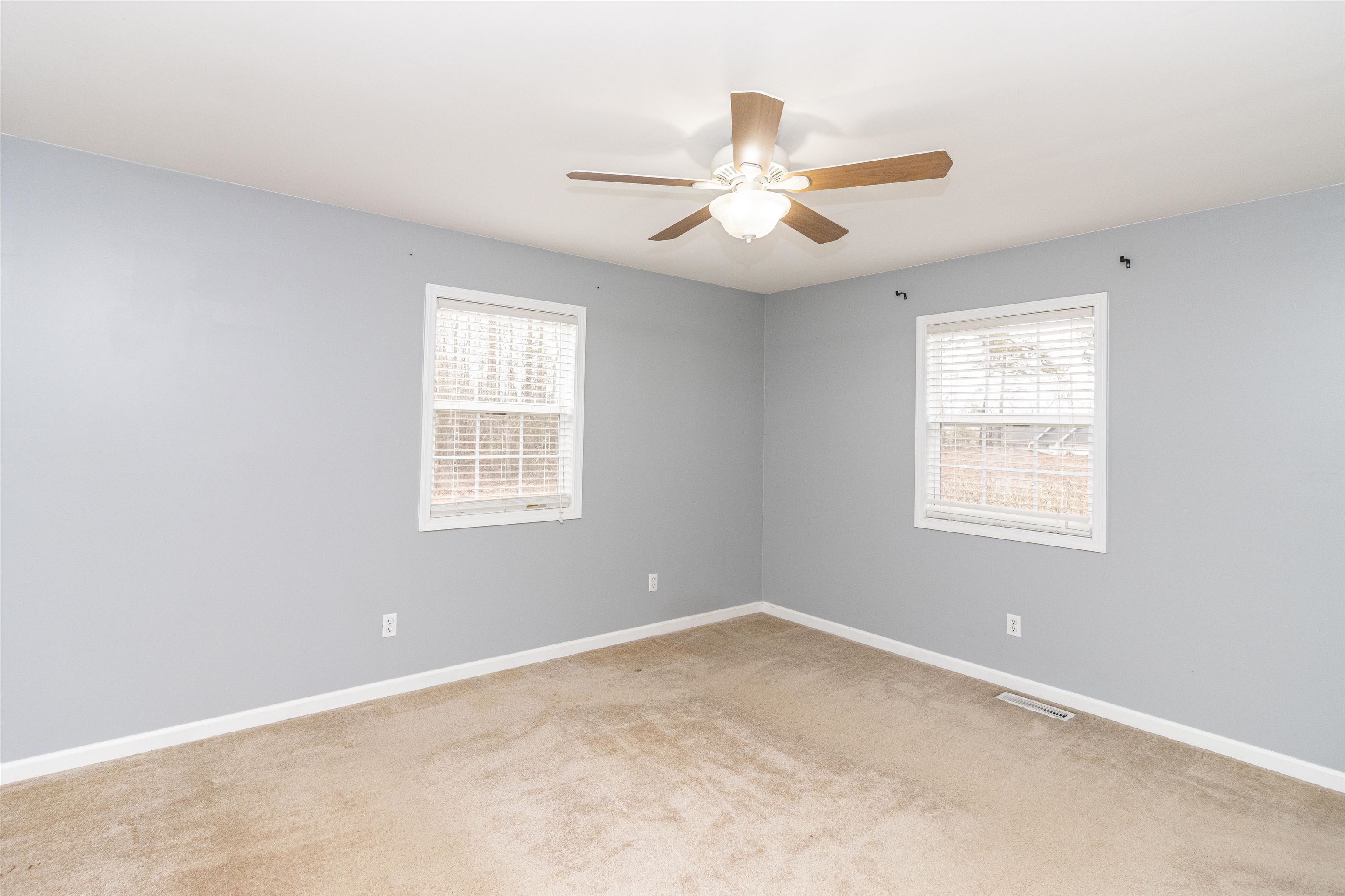 1468 Matrose Carroll Road Michie, TN 38357 - Photo 12 of 27 an empty room with windows and fan