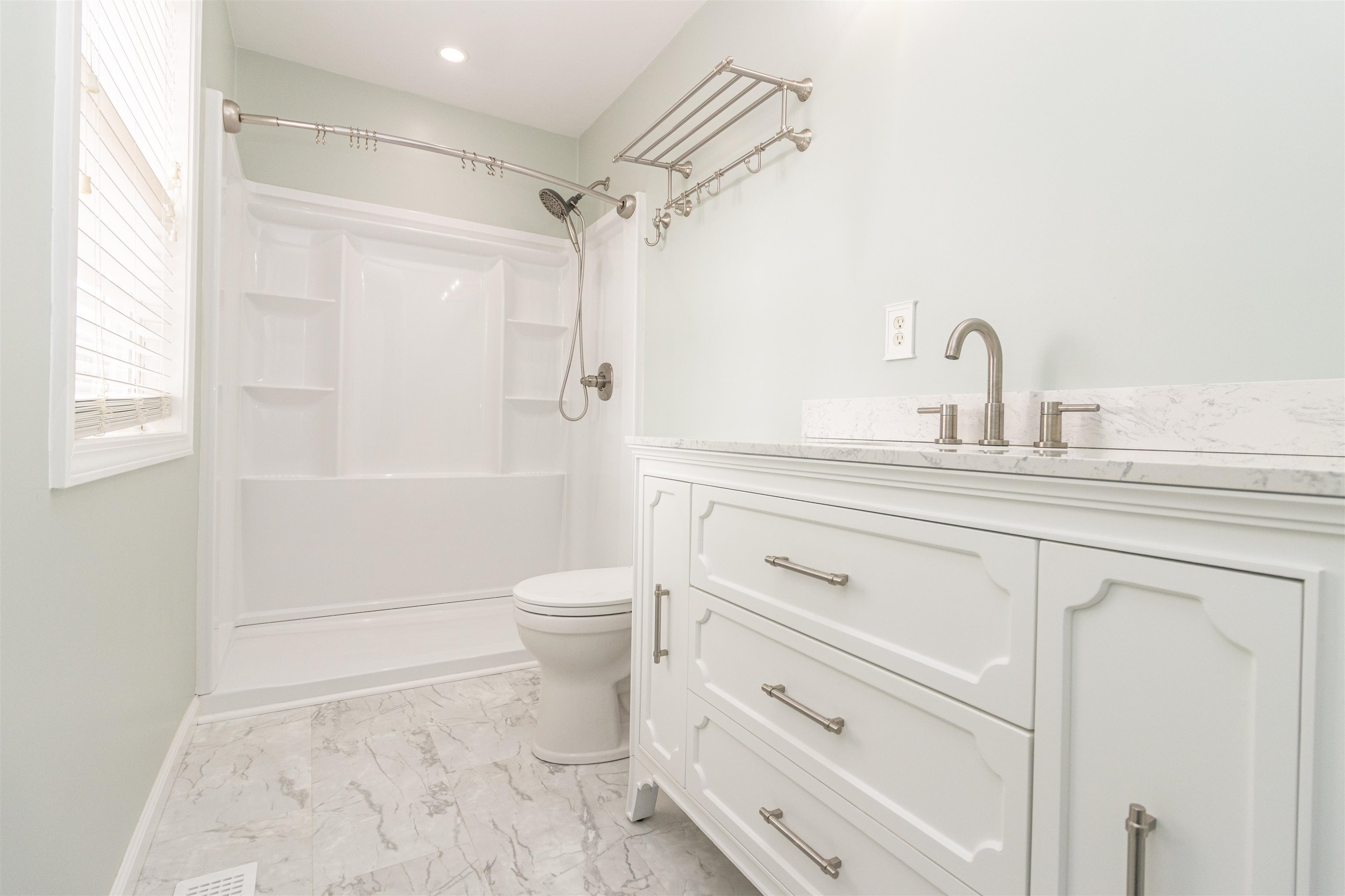 1468 Matrose Carroll Road Michie, TN 38357 - Photo 13 of 27 a bathroom with a sink a toilet and shower