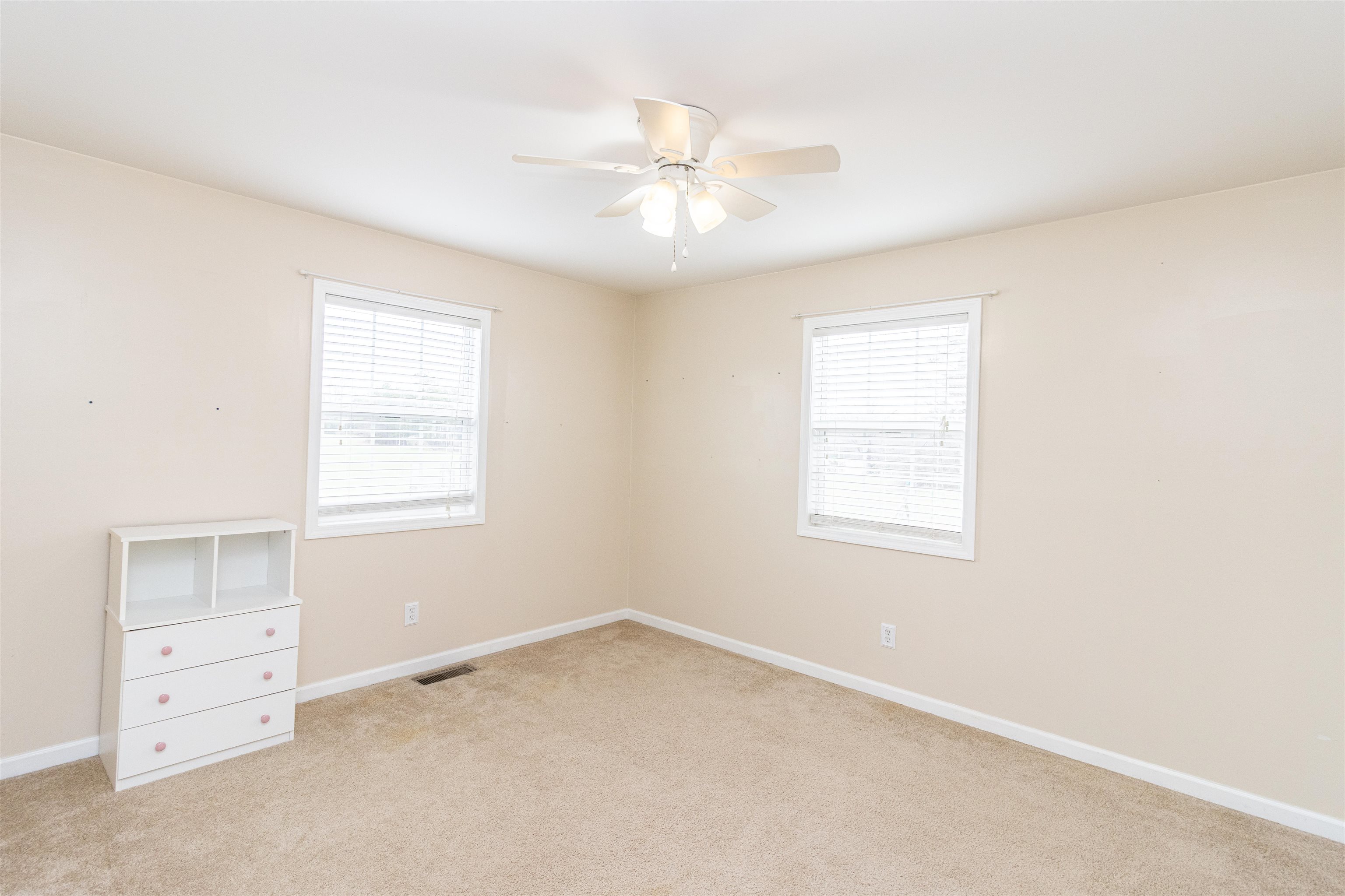 1468 Matrose Carroll Road Michie, TN 38357 - Photo 14 of 27 an empty room with windows and fan