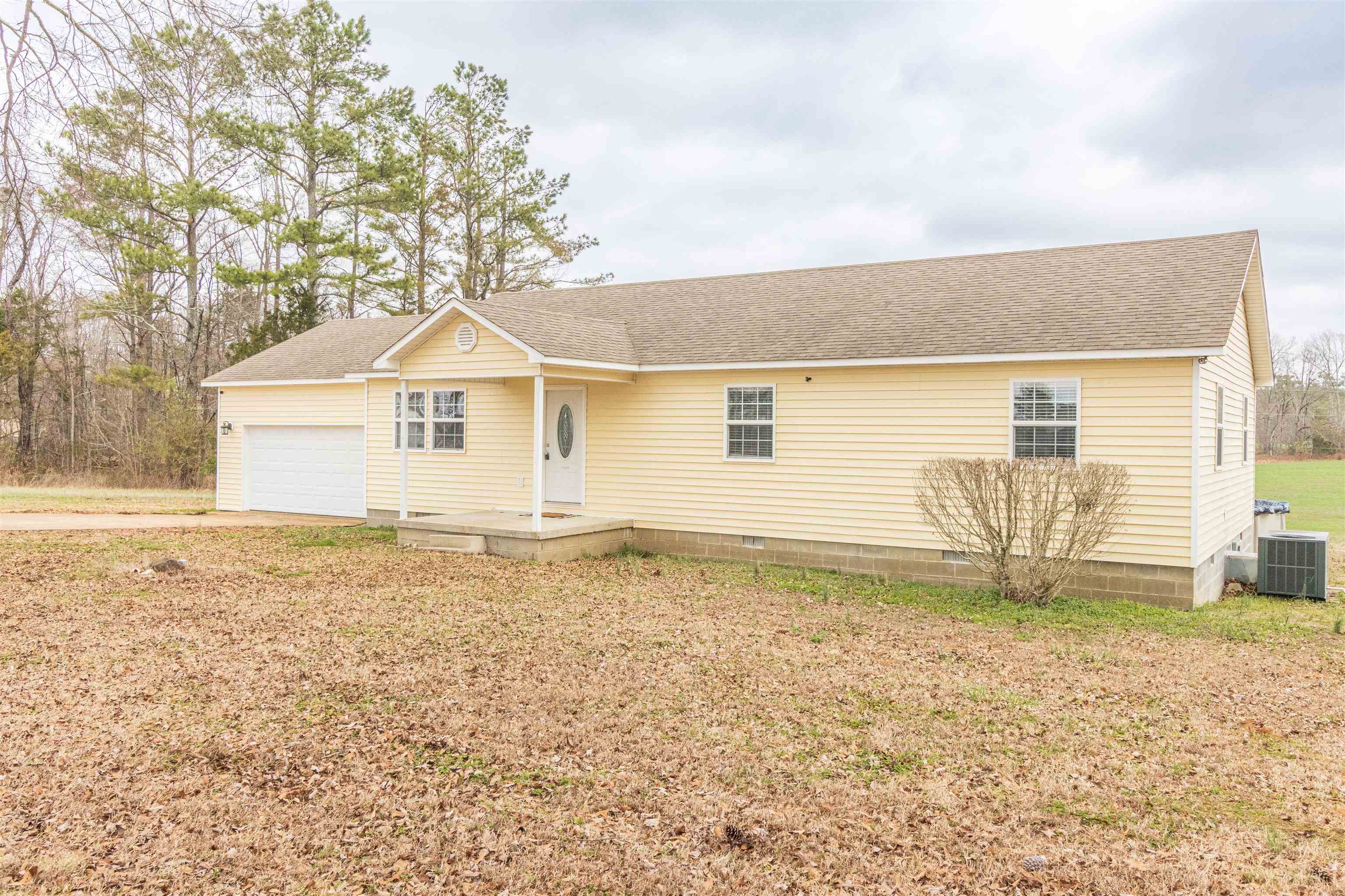 1468 Matrose Carroll Road Michie, TN 38357 - Photo 2 of 27 a front view of a house with a garden
