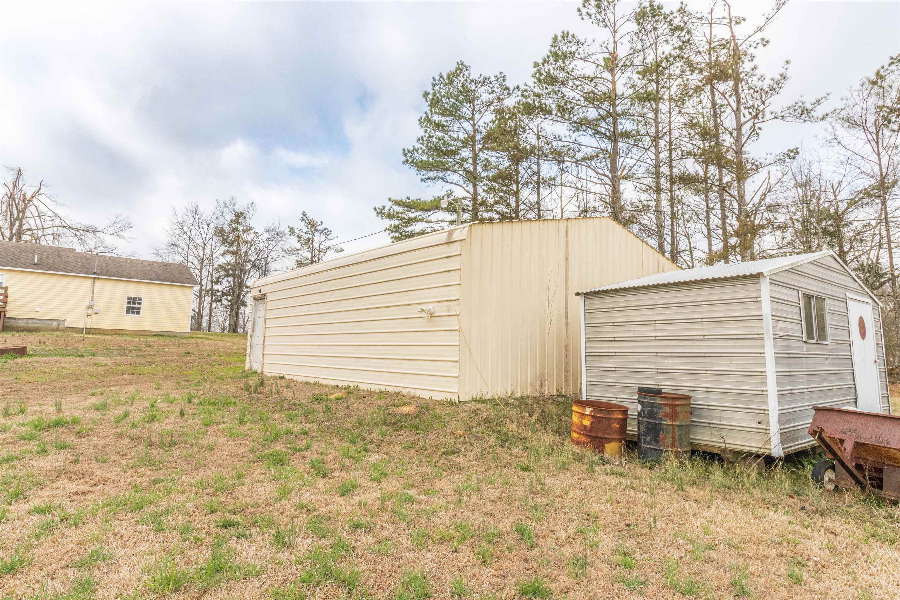 1468 Matrose Carroll Road Michie, TN 38357 - Photo 21 of 27 a view of a house with backyard and trees