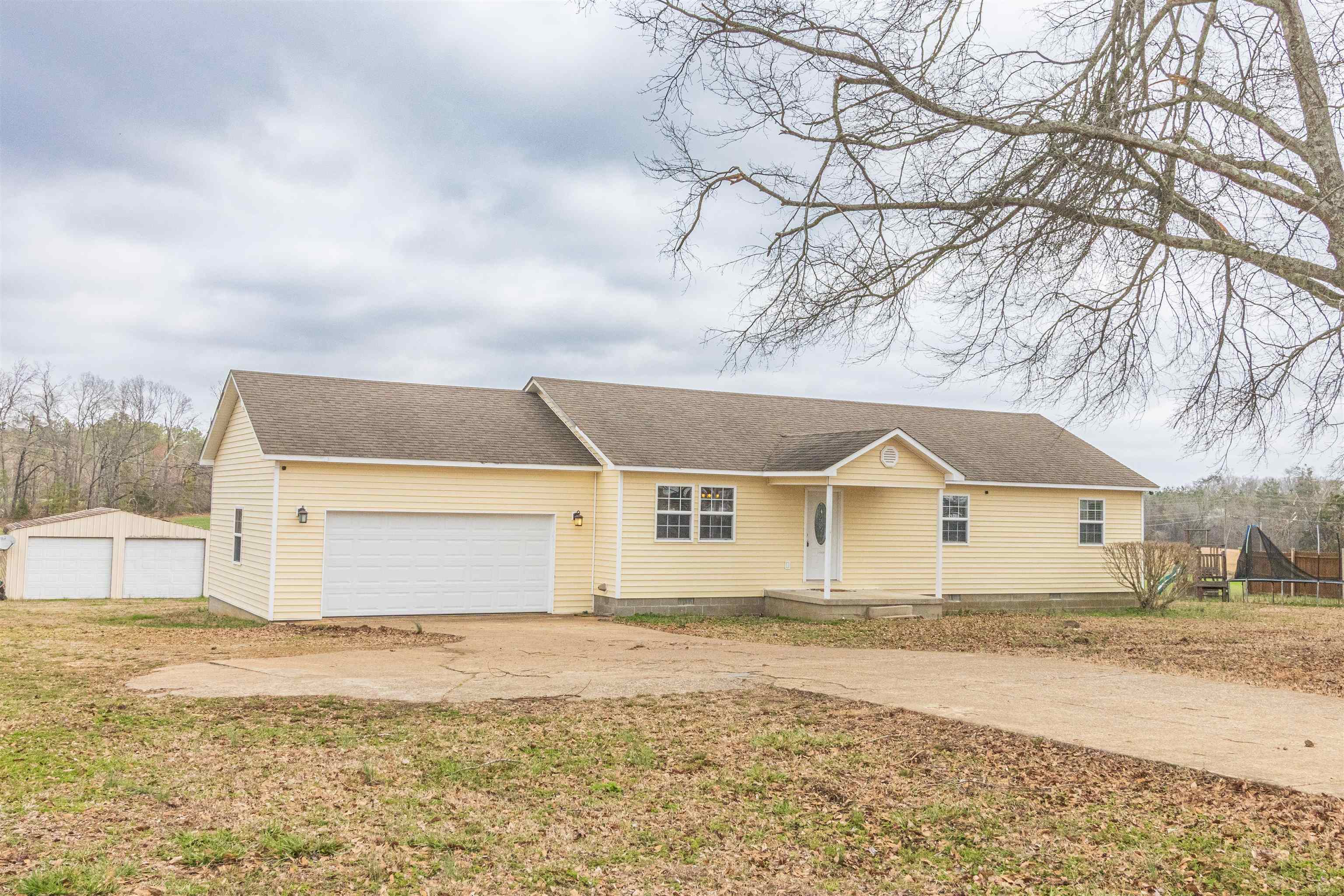 1468 Matrose Carroll Road Michie, TN 38357 - Photo 27 of 27 a front view of a house with a yard