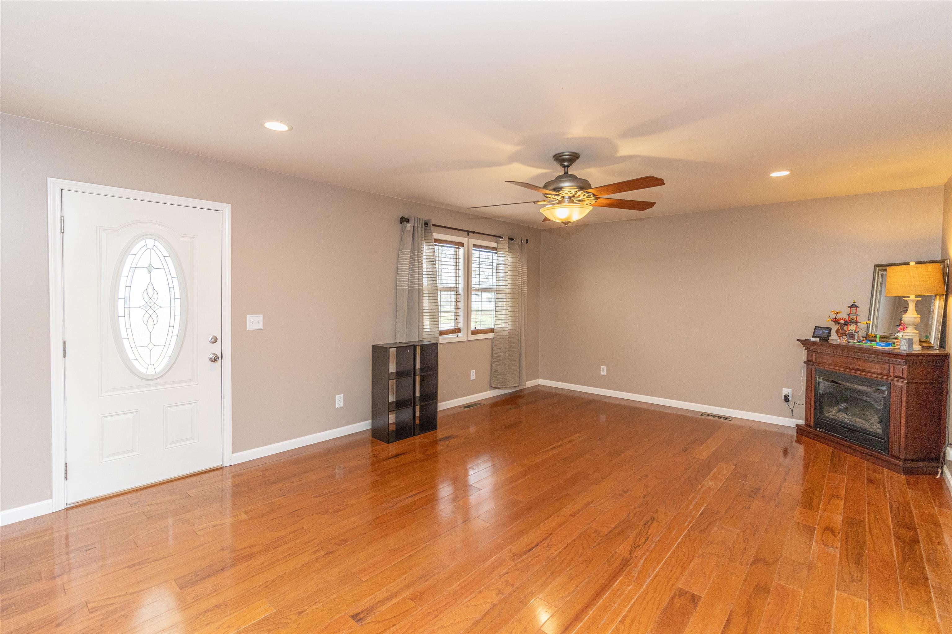 1468 Matrose Carroll Road Michie, TN 38357 - Photo 4 of 27 wooden floor in an empty room with a window
