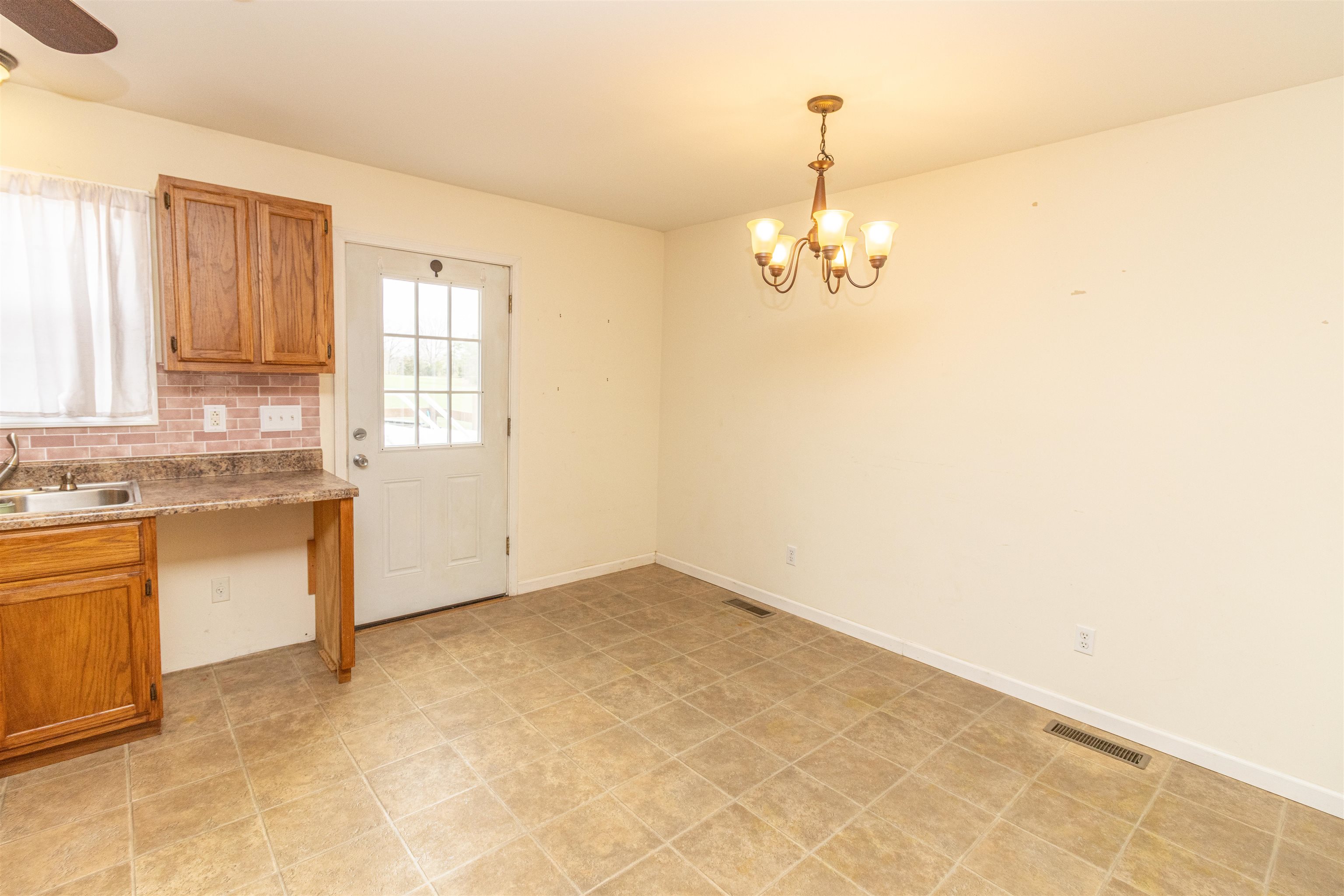 1468 Matrose Carroll Road Michie, TN 38357 - Photo 10 of 27 a view of kitchen with granite countertop cabinets and window